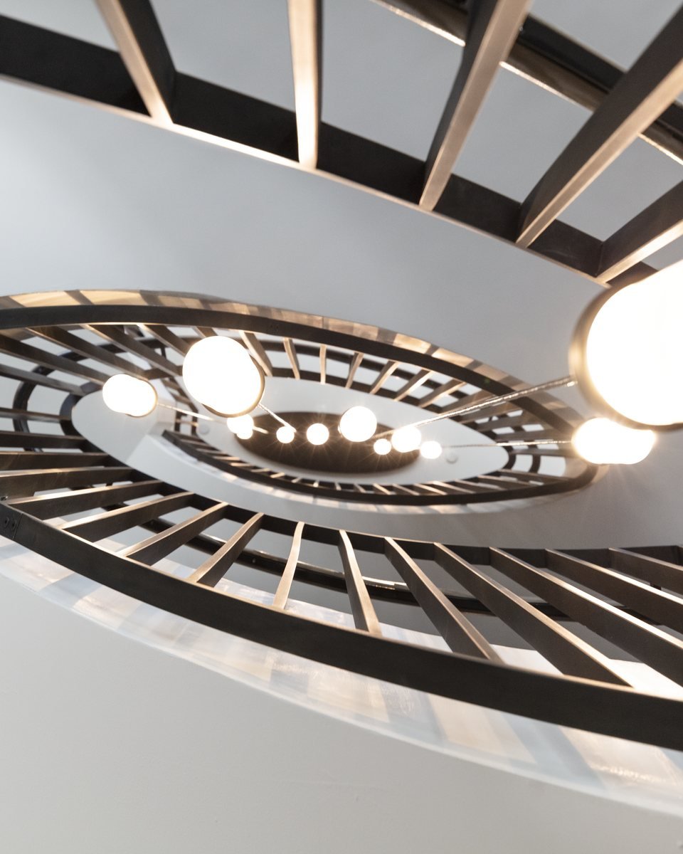 Sculptural feature stair with wood screen